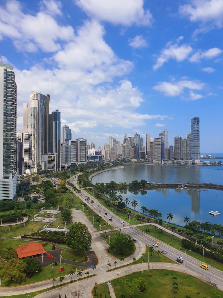 A breathtaking view of Panama City's modern skyline and oceanfront under a blue sky.