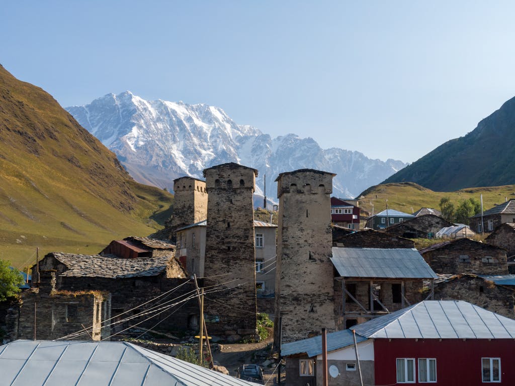 Svan towers in Ushguli, Georgia, set against the scenic Caucasus Mountains.