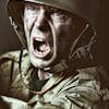 Close-up of a soldier in camouflage shouting during a military action scene.